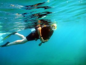 SCUBA diver snorkeling in clear water – Best Places In The World To Retire – International Living